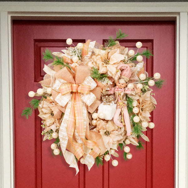 Christmas 28" glam wreath with a whimsical decorative elf, plush package, velvet poinsettias, ball sprays, and evergreens. W21106A