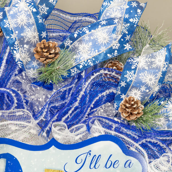 Gnome snowman wreath 26" blue and white with snow flocked pine sprigs and real pine cones. For door or wall. W21117A