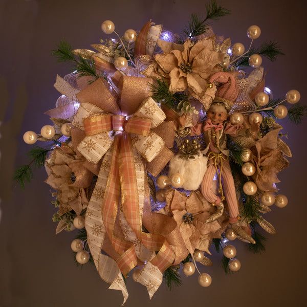 Christmas 28" glam wreath with a whimsical decorative elf, plush package, velvet poinsettias, ball sprays, and evergreens. W21106A